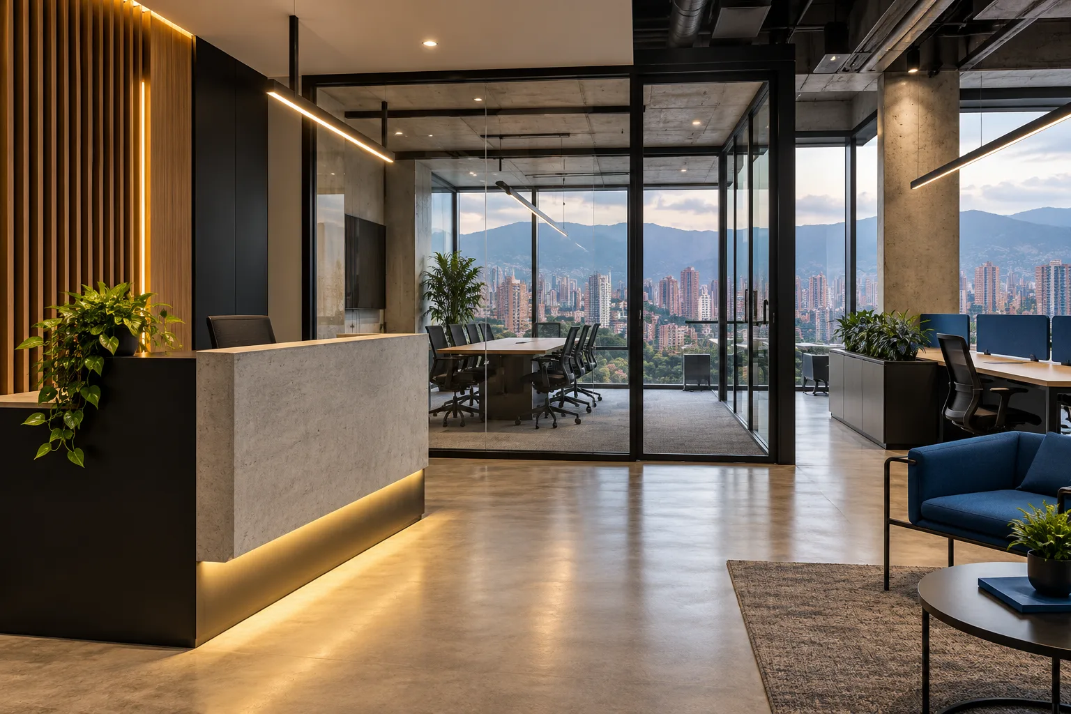 Remodelación de locales y oficinas en Medellín: distribución y acabados Oficina urbana en Medellín con recepción de concreto, divisiones de vidrio y vista a las montañas